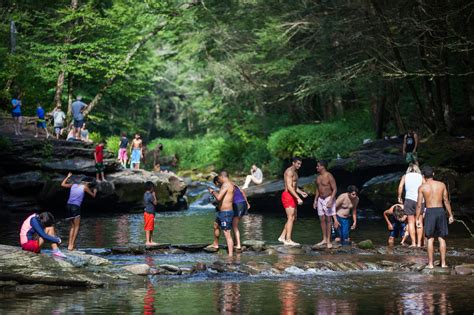 The swimming hole - The swimming hole is like a half acre, depth of 10-15ft and water is really nice end of summer but very cold until then. Follow the signs to the Chagrin Falls viewing area then and take the worn down to the falls and swimming hole.